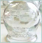 A close up of a glass vase with water inside